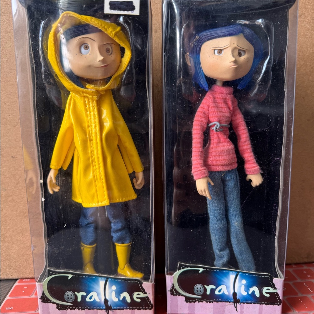 Two Coraline Dolls NECA 2009 Raincoat and Striped Sweater outfits
